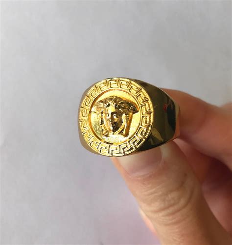 versace 18k gold ring.